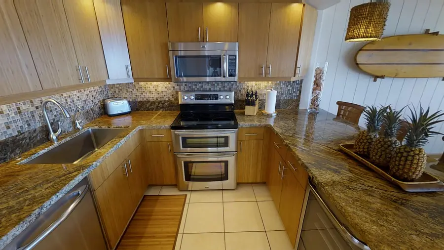 Beautiful kitchen, includes double oven, under counter beverage fridge, built-in recycling station, LED lights!