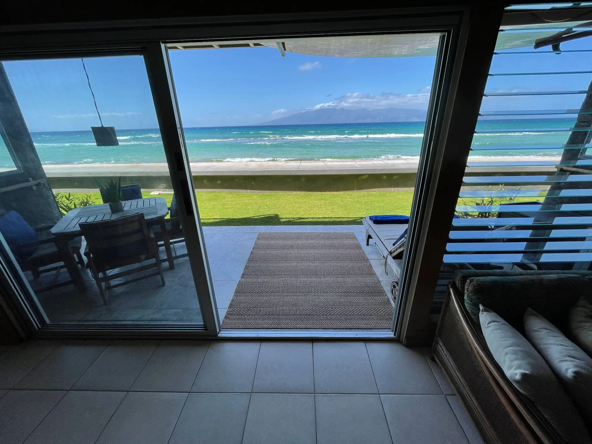 View through the open doors of Maui Sands Unit 4B toward the ocean and Molokaʻi