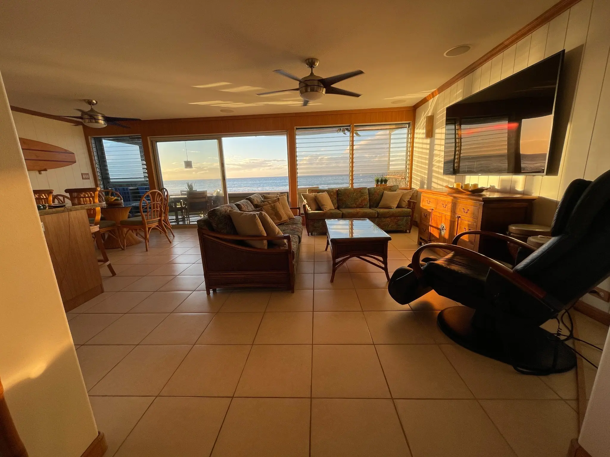 Oceanfront living room at sunset with the 100-inch television